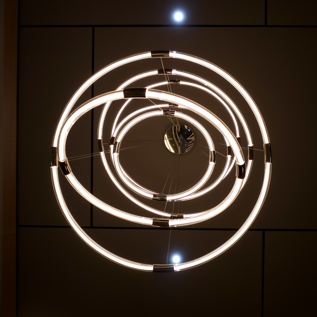 a circular light fixture hanging from the ceiling