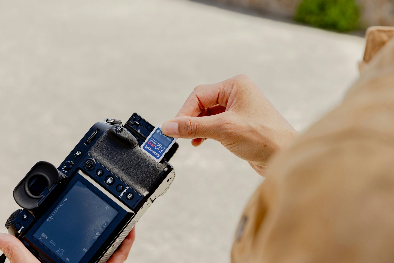 A person holding a camera in their hand